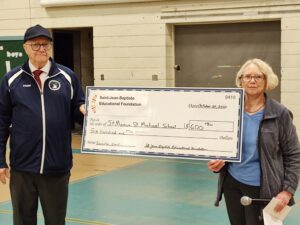 Jeannine A. Young, President, CFL chapter N443 St. Jean, VT , presented the St Jean Baptiste Educational Foundation Catholic School Grant donation check to St. Monica-St. Michael School Principal Michael Alford. The school was very appreciative of the grant.